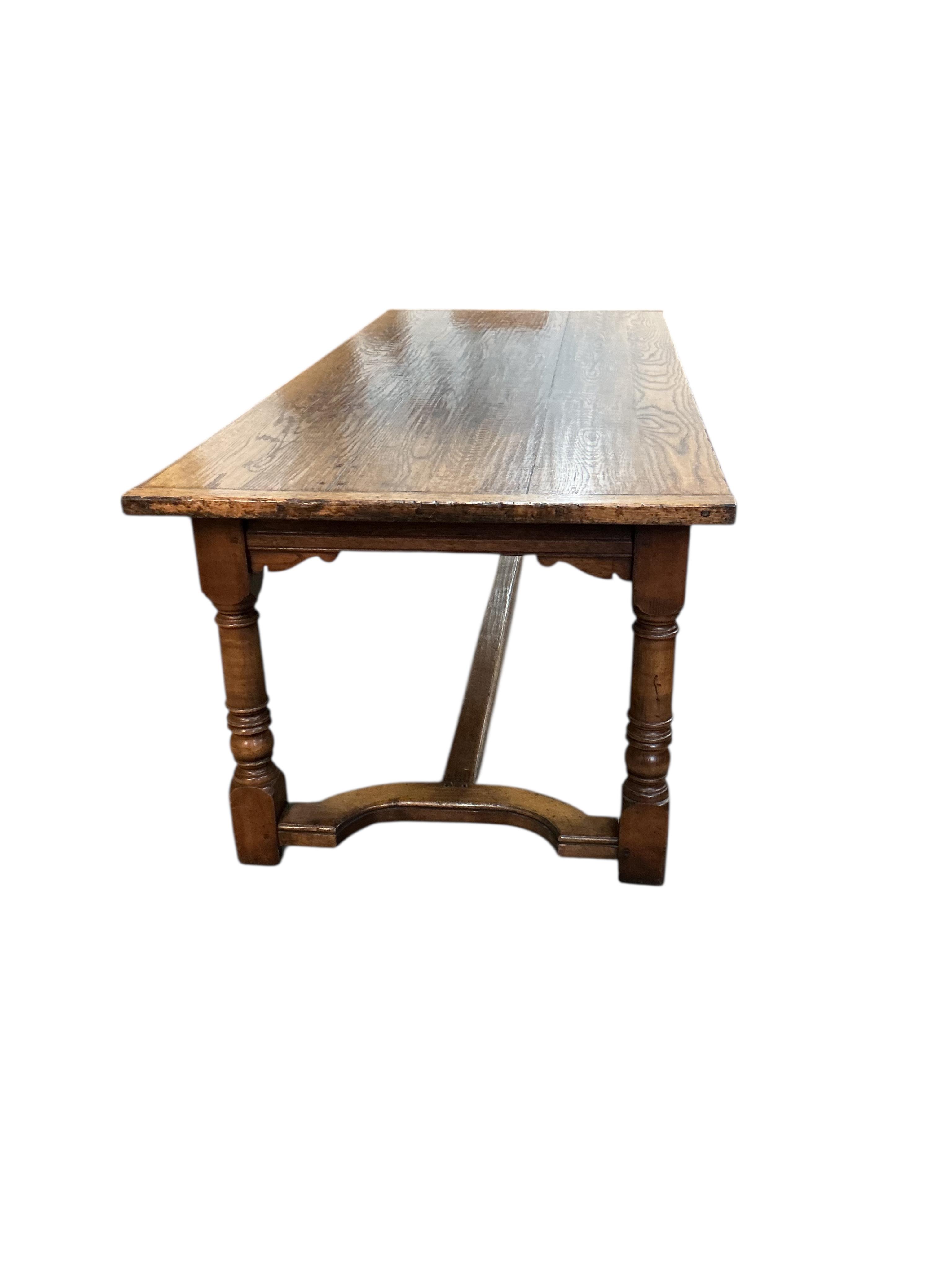 An 18th century style rectangular oak refectory dining table, width 214cm, depth 90cm, height 77cm together with six panelled oak high back dining chairs and two oak elbow chairs